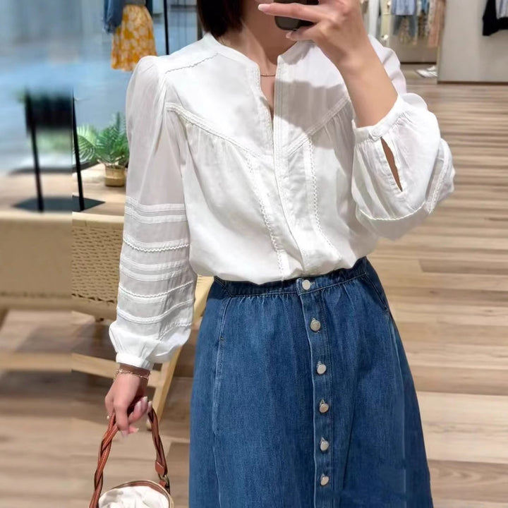 Damebluse med elegante detaljer og broderede accenter Stilla