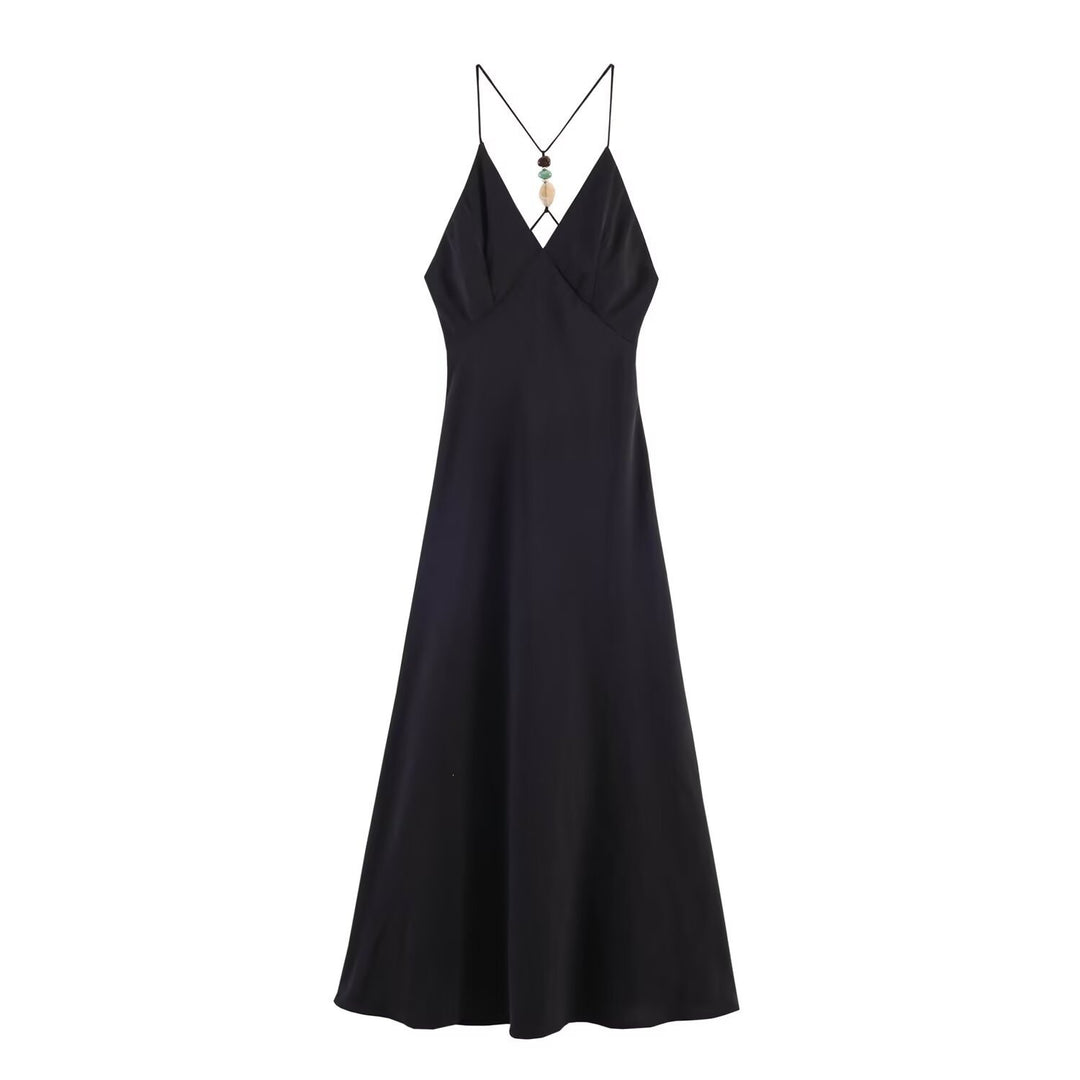 Dame maxikjole med delikat spaghetti-stropdesign og elegant drapering Skovae