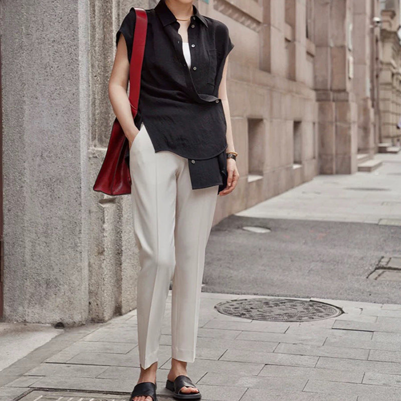 Dame stilfuldt top med asymmetrisk snit og elegante detaljer Stilla