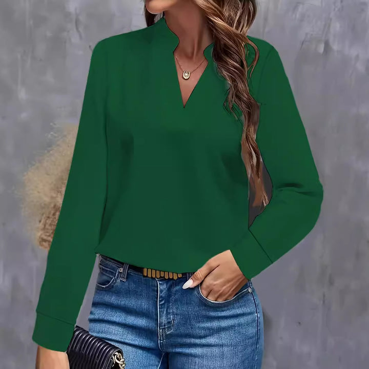Dame elegant bluse i minimalistisk design med dekorativ V-udskæring og lange ærmer Stilla