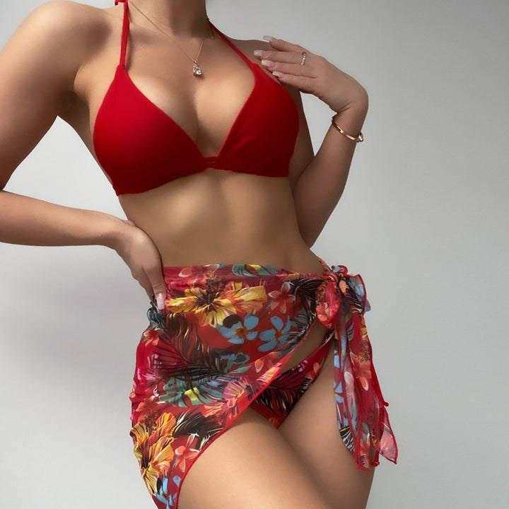 Dame triangel-bikini med mode indpakning nederdel og farverigt blomster mønster Stilla