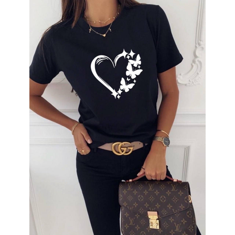 Dame T-shirt med kunstnerisk sommerfugl- og hjertemotiv Stilla