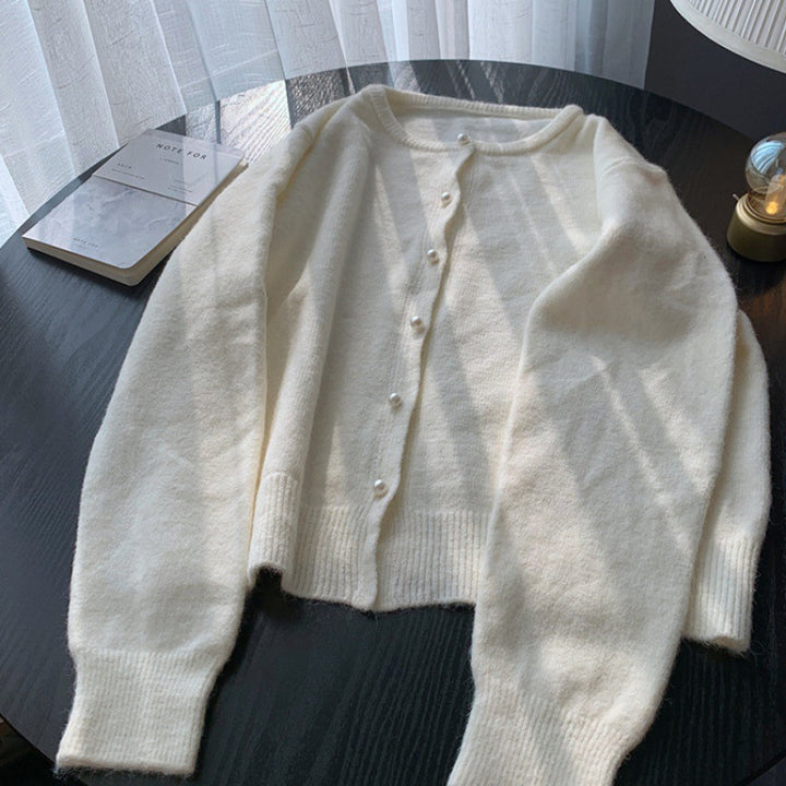 Kvinders cardigan med elegante perleknapper og moderne design Stilla