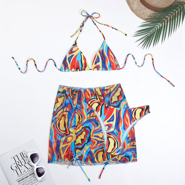 Dame trendy triangel-bikini-sæt med halvtransparent indpakningsskørt og farverigt mønster Stilla
