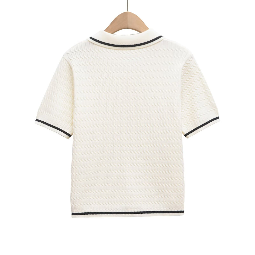 Dame polo shirt med struktureret materiale og fine knapdetaljer Skovae