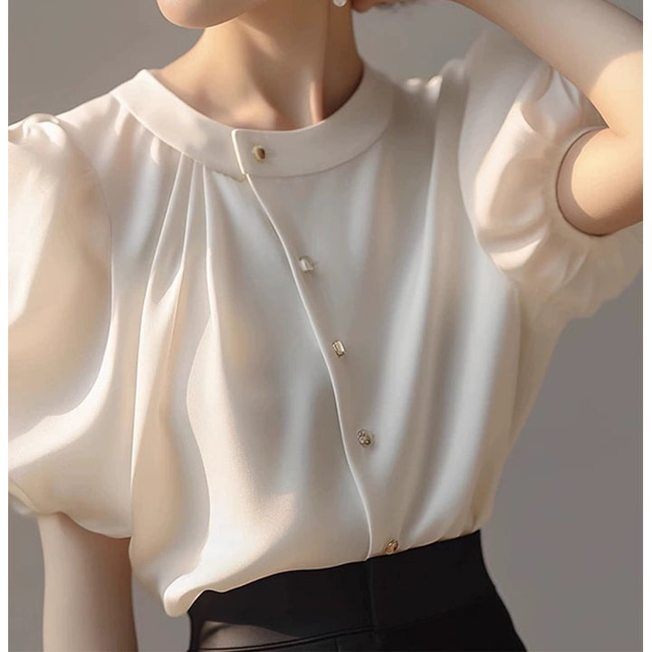 Dame elegant bluse med voluminøse ærmer og dekorative knapdetaljer Stilla