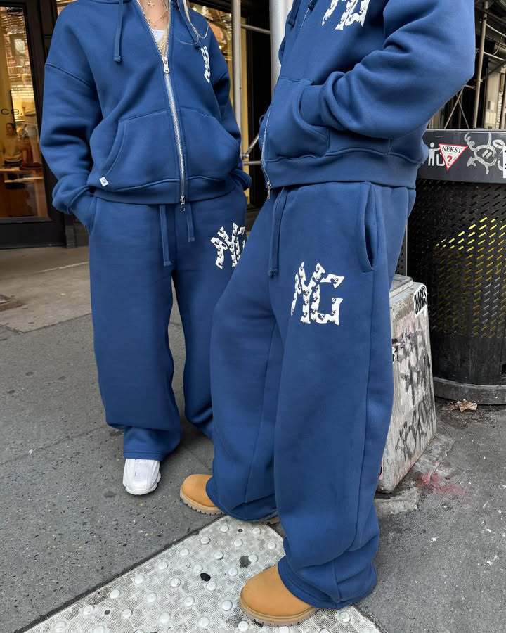 Unisex nan langt skåret hoodie sweatjakke med dobbeltsidet lynlås og logo-applikation Skovae