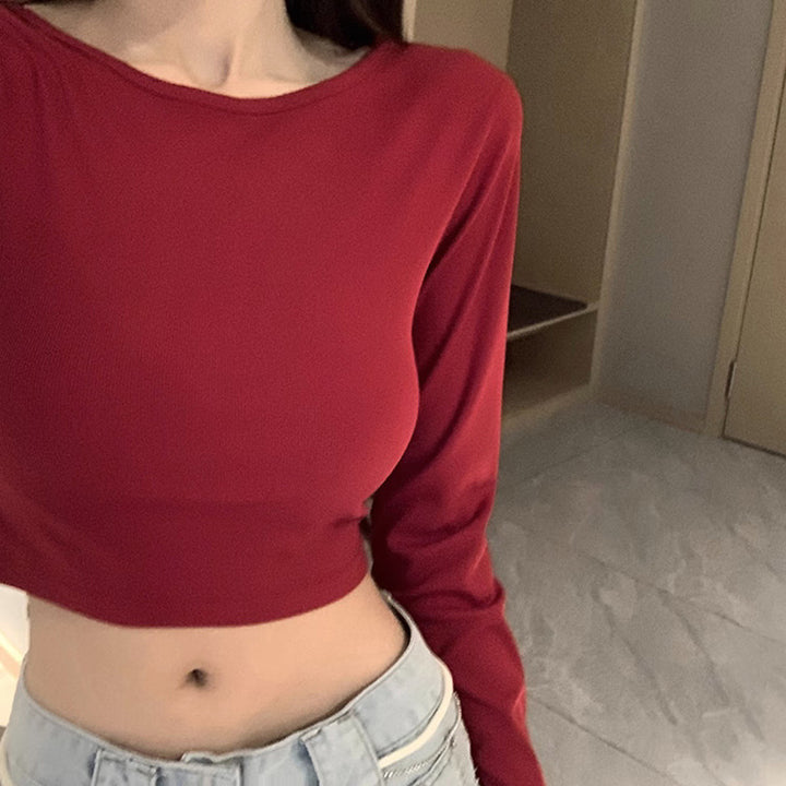 Kvindernes langærmede crop top med krydsryg og elegant V-hals
