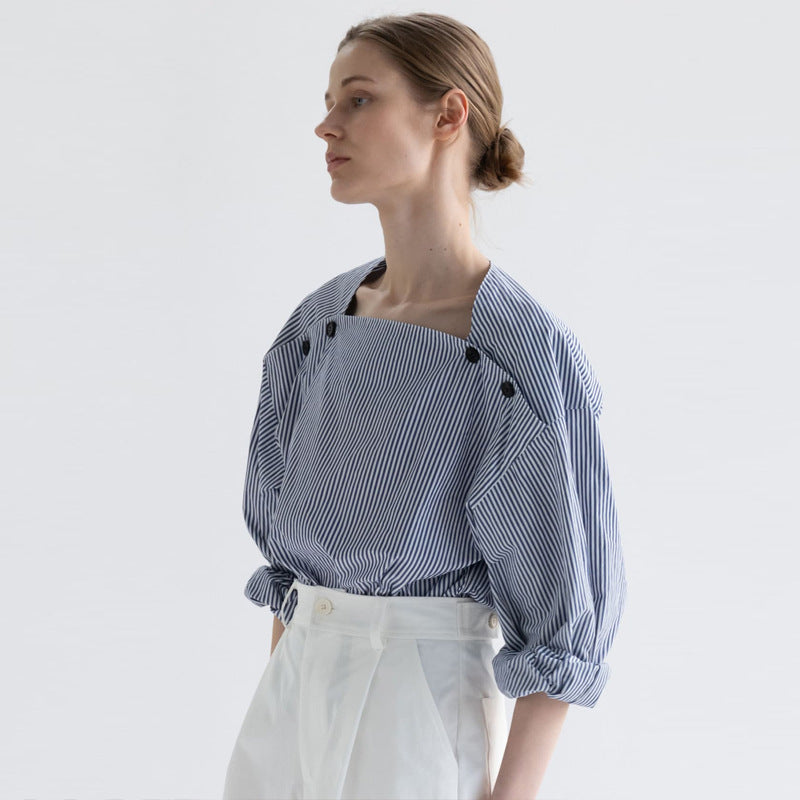 Kvinders fashionable bluse med innovative knapdetaljer Stilla