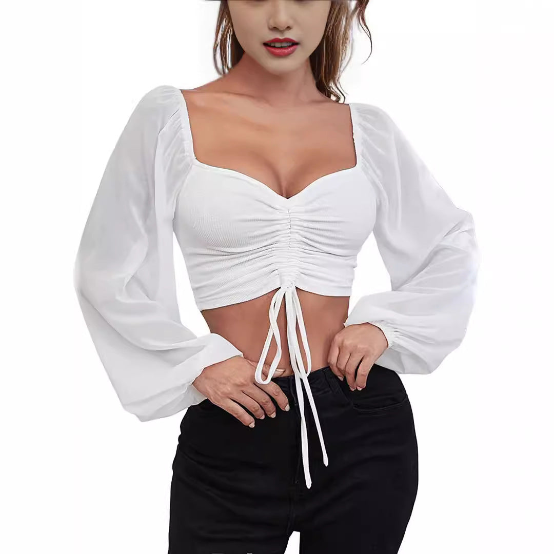 Dame Crop-Top med struktureret krop og elegante pufærmer Skovae