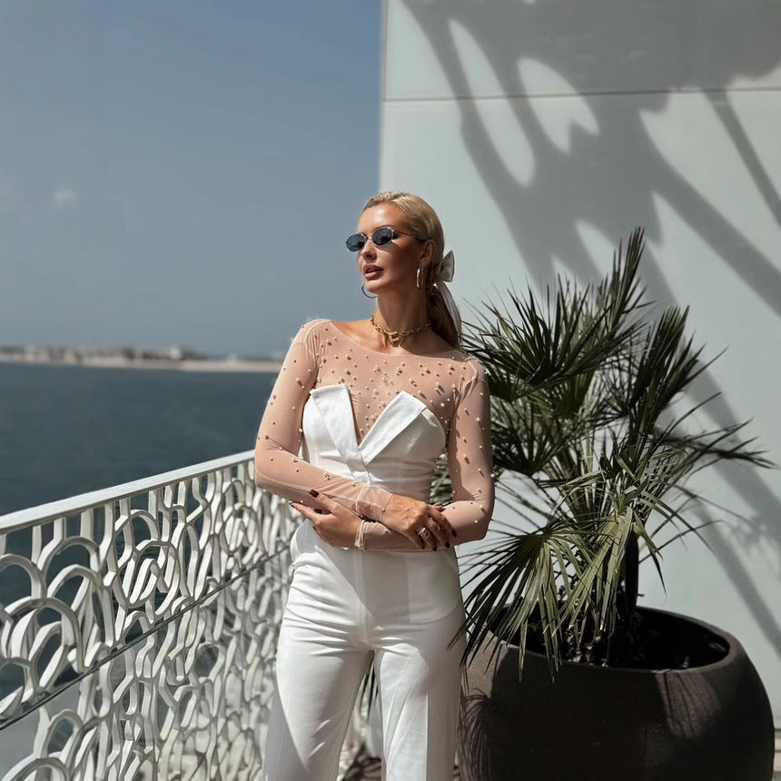 Damer elegant jumpsuit med gennemsigtige ærmer og perledekor Skovae