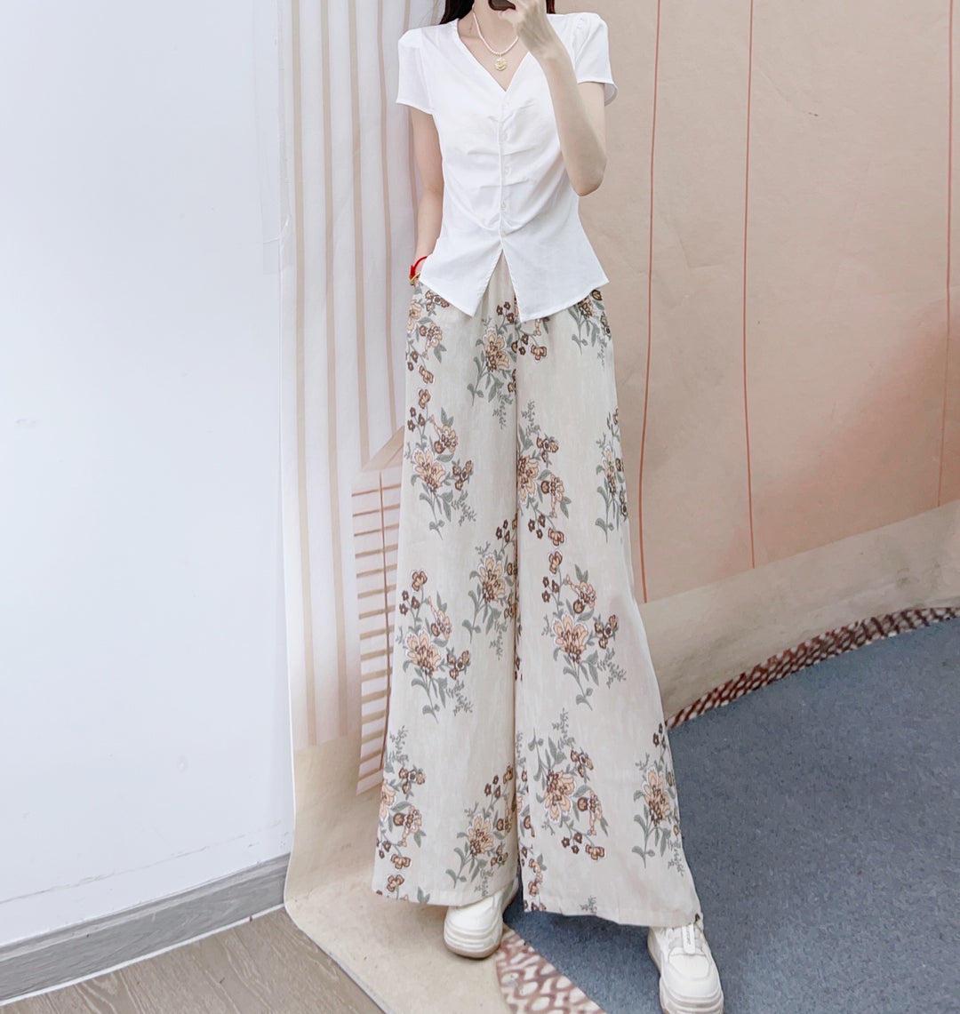 Dame Elegant og figurtilpasset bluse med blomsterprint og bred buksedragt Stilla