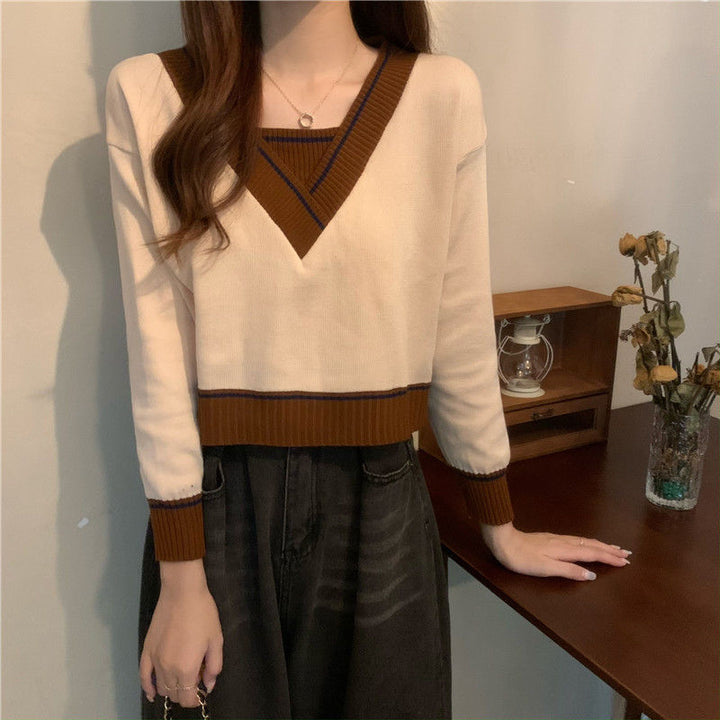 Damer modevenlig V-hals sweater med kontrastdetaljer Stilla