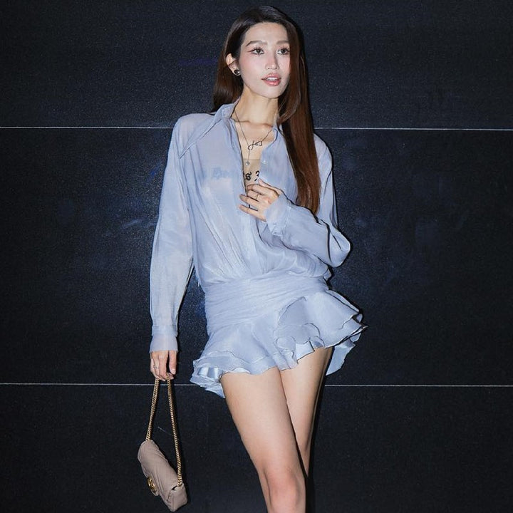 Dame modebluse med raffinert vikledesign og transparente elementer Stilla