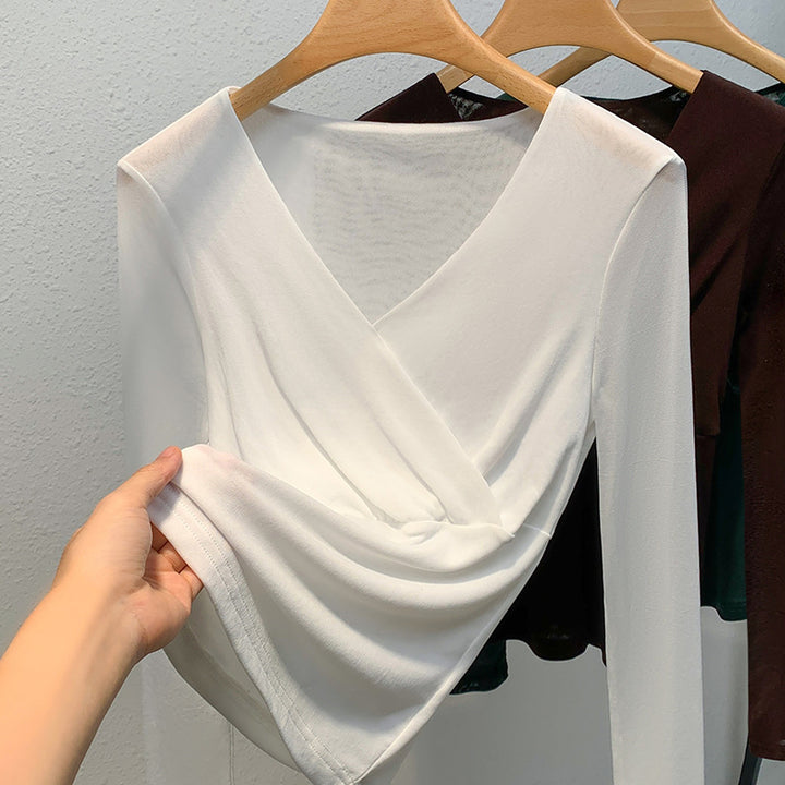 Dame elegant indpakningsbluse lavet af flydende materiale med raffinerede draperingsdetaljer Stilla