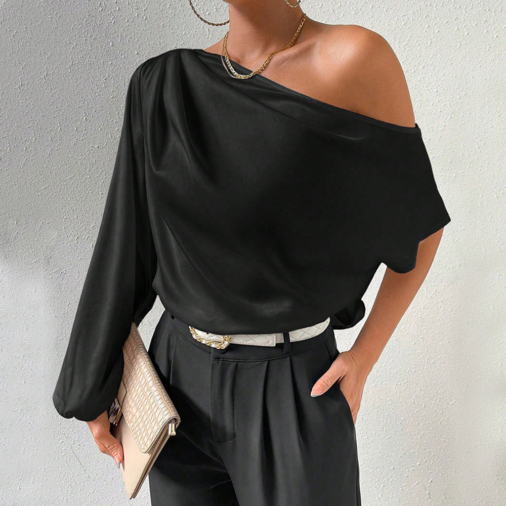 Kvindernes asymmetriske top med elegante puffærmer Stilla