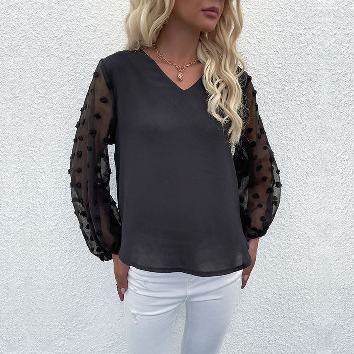 Damebluse med elegante pufærmer og struktureret overmateriale Skovae