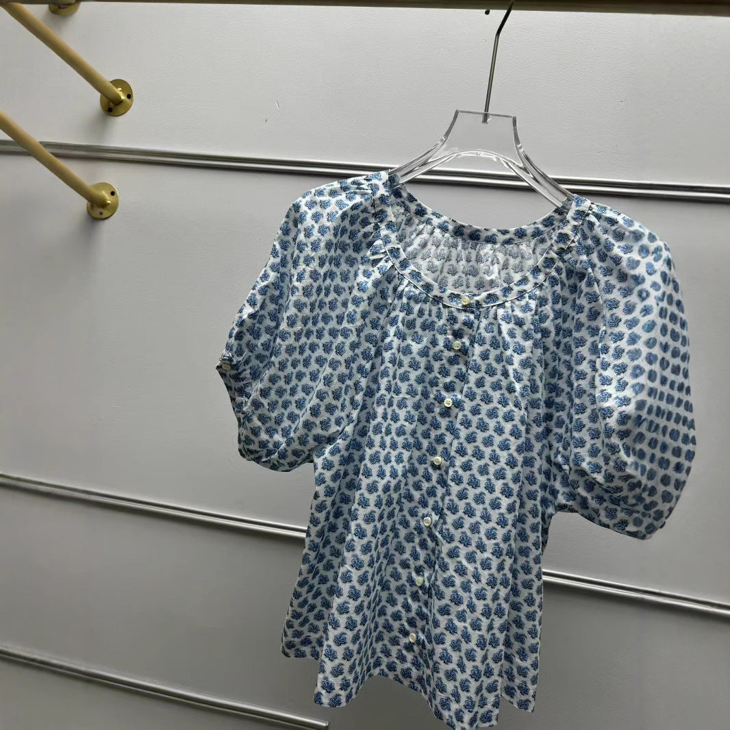 Damebluse med elegant V-halsudskæring og ballonformede ærmer Stilla