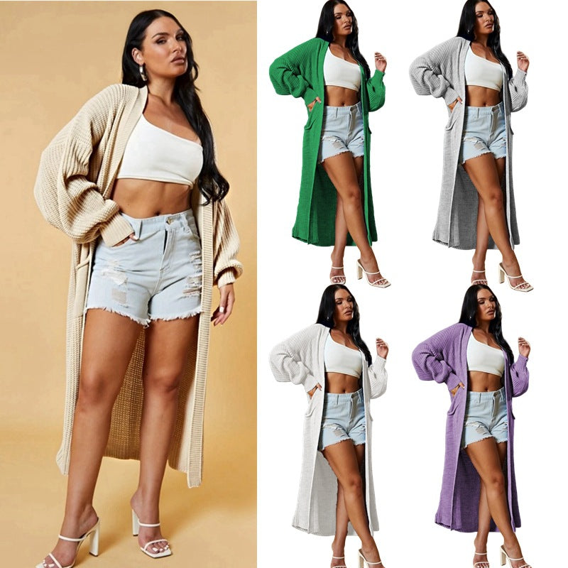Kvinders lange strikket cardigan med åbent design og praktiske lommer Stilla