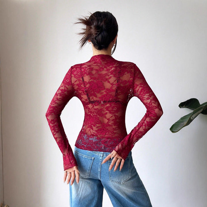Dame nan figurbetonede transparente spids-crop-top med høj hals og integreret bustier-form Skovae