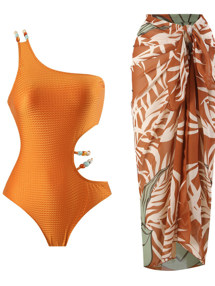 Dame Ensidig Badedragt med elegante Cut-Outs og matchende Wrap Skirt Stilla