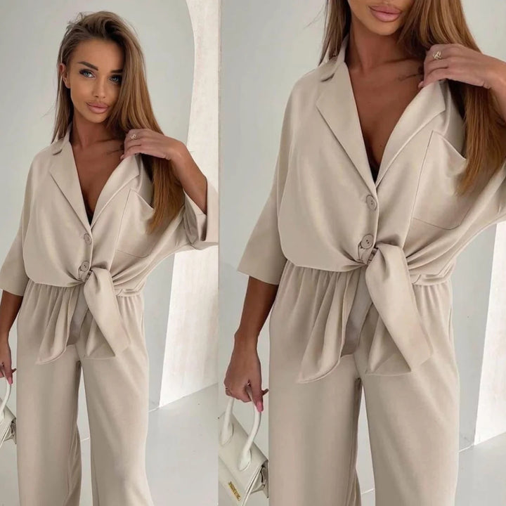 Kvinders afslappede jumpsuit med bælte og bredskårede ben