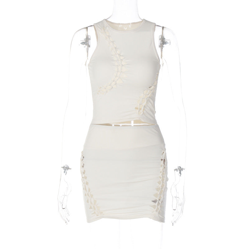 Dame Sæt bestående af sporty top og figursyet miniskørt med trendy cut-out-detaljer Stilla