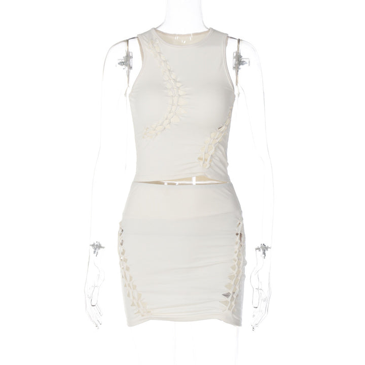 Dame Sæt bestående af sporty top og figursyet miniskørt med trendy cut-out-detaljer Stilla