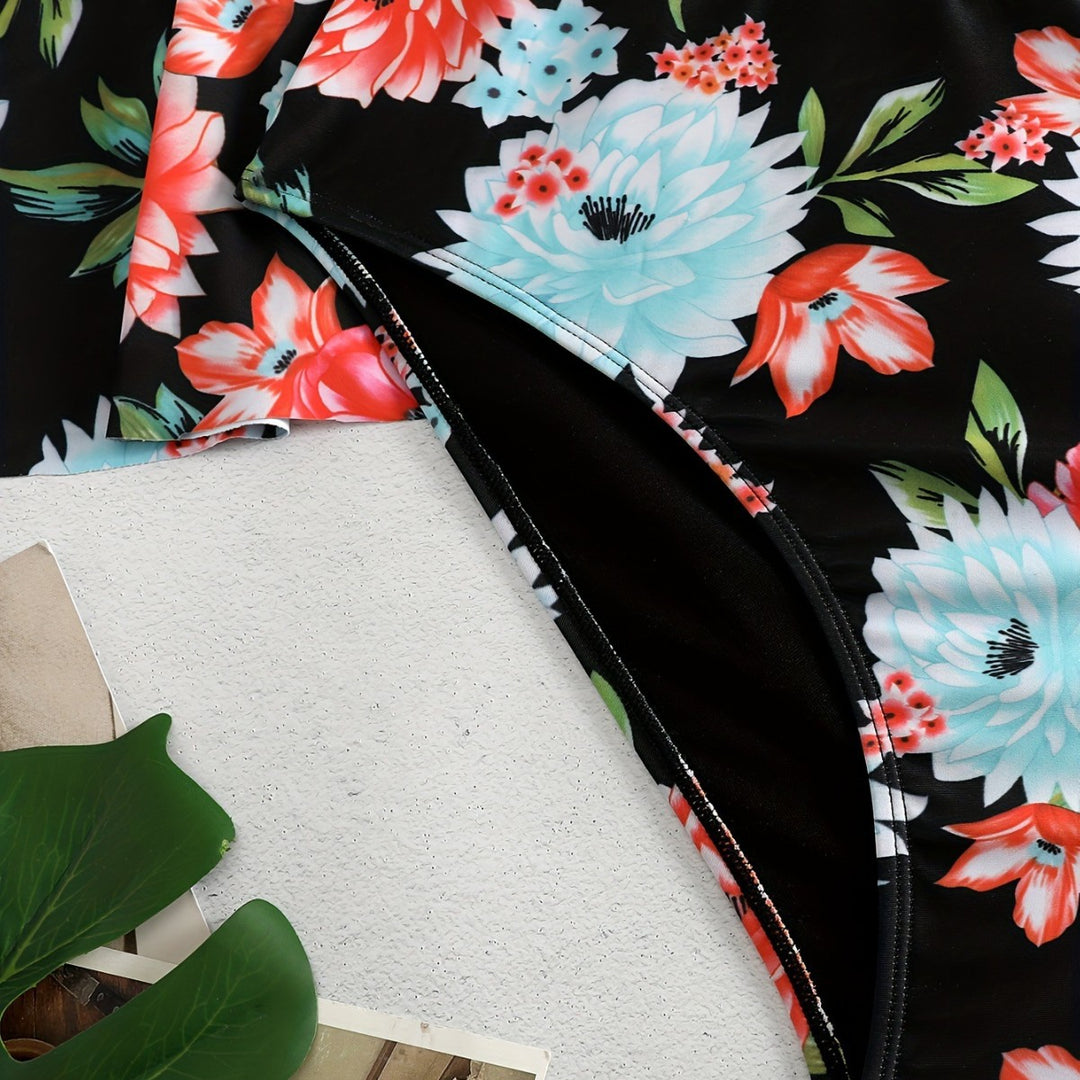 Dame én-delt badedragt med ruffledetails og blomstret design Skovae