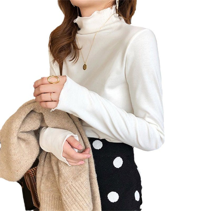Kvinders langærmet turtleneck top med fint rib design og afslappet pasform
