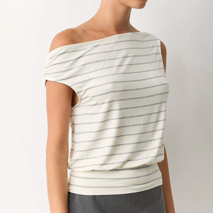 Dame asymmetrisk langærmet skjorte med moderne stribemønster og elegante cut-out-detaljer Skovae