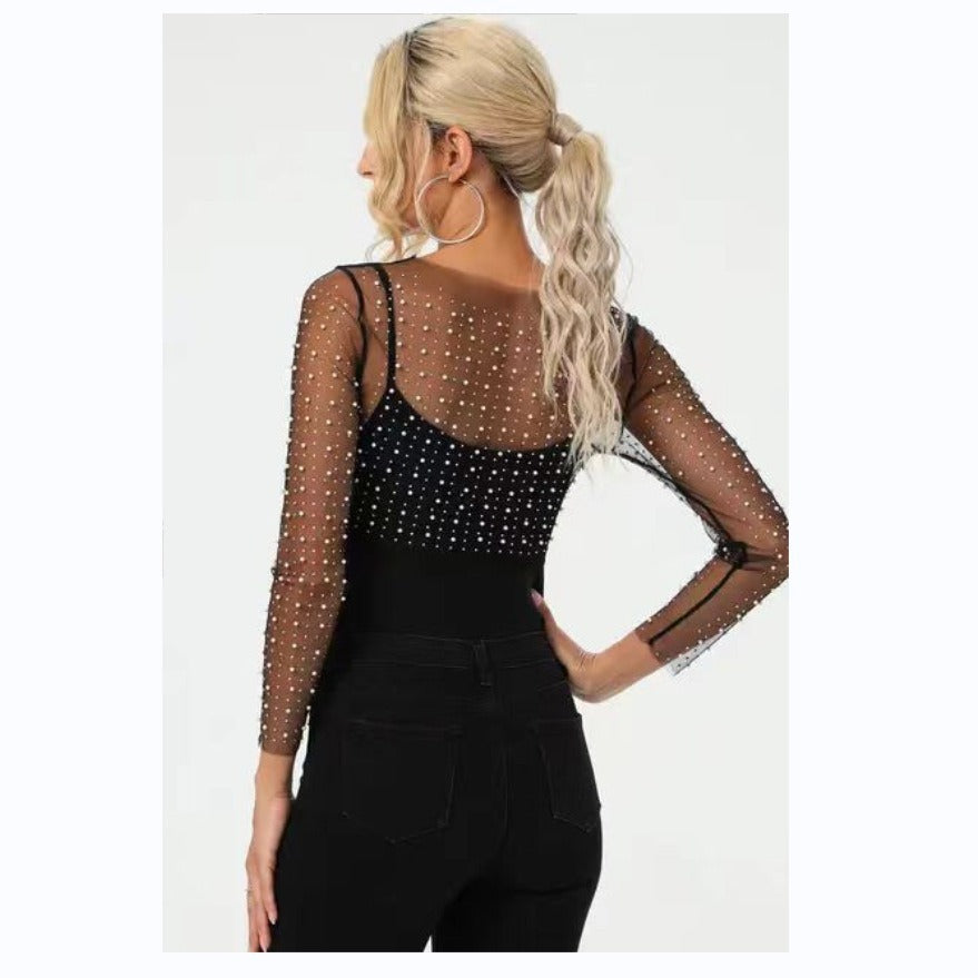 Dame elegant bodysuit med transparente ærmer og glitrende detaljer Stilla