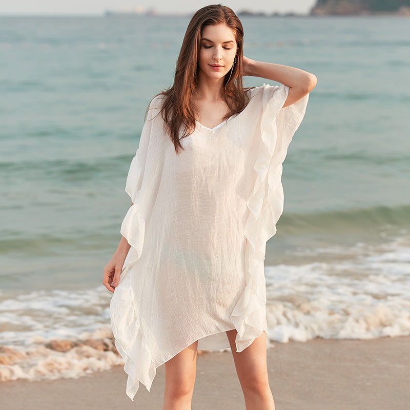 Damer elegant strandponcho med voluminøse flæsedetaljer Stilla