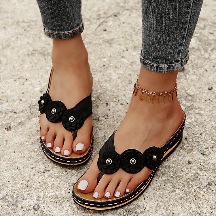 Dame slip-in sandaler med elegante blomsterapplikationer og ergonomisk sål Stilla