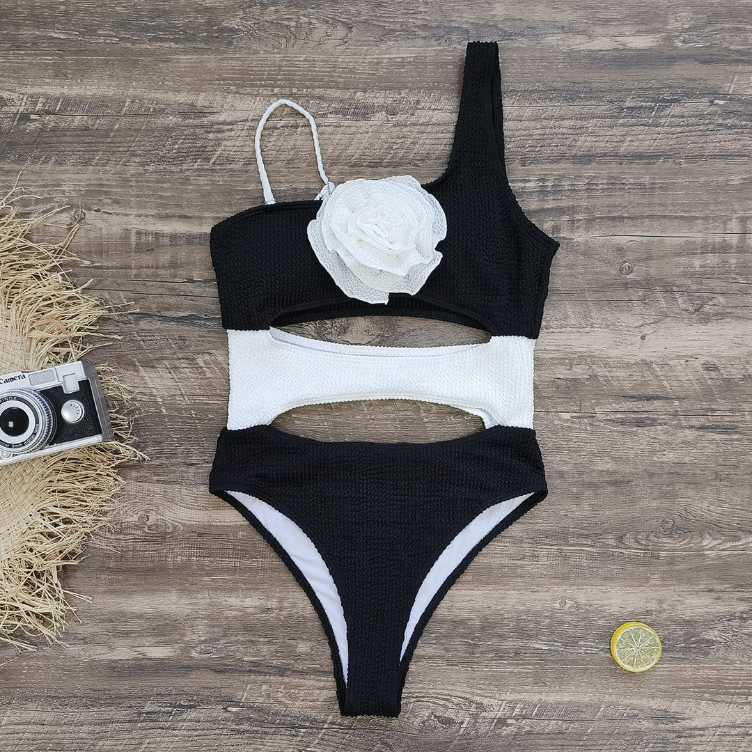 Dame én-delt badedragt med iøjnefaldende cut-outs og blomstret detalje Stilla