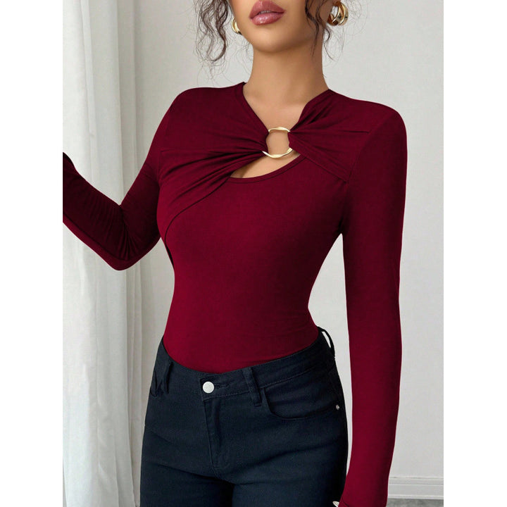 Dame bodysuit med dekorativt ringdetalje og lange ærmer Skovae