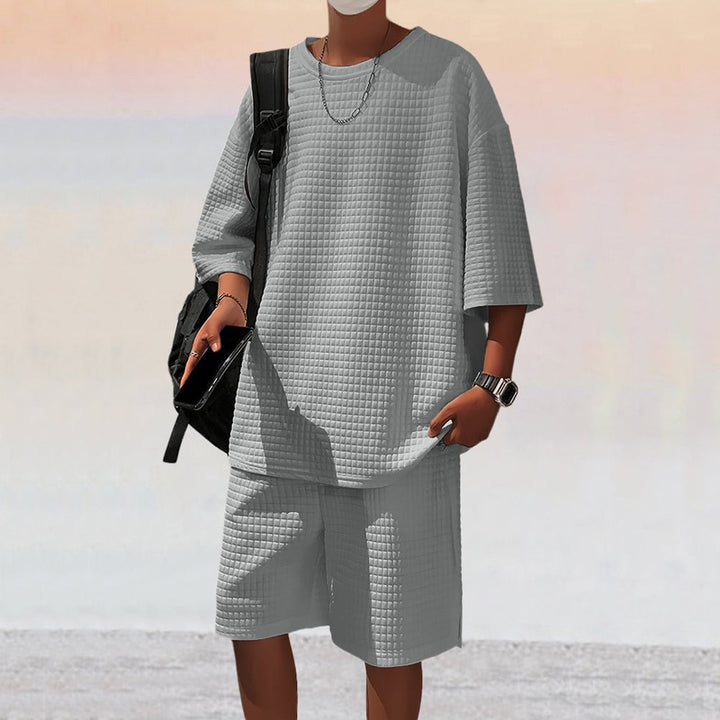 Herrer nan kvadratstruktur fritidsæt med oversized rundhalstrøje og knælange afslapningsshorts Skovae