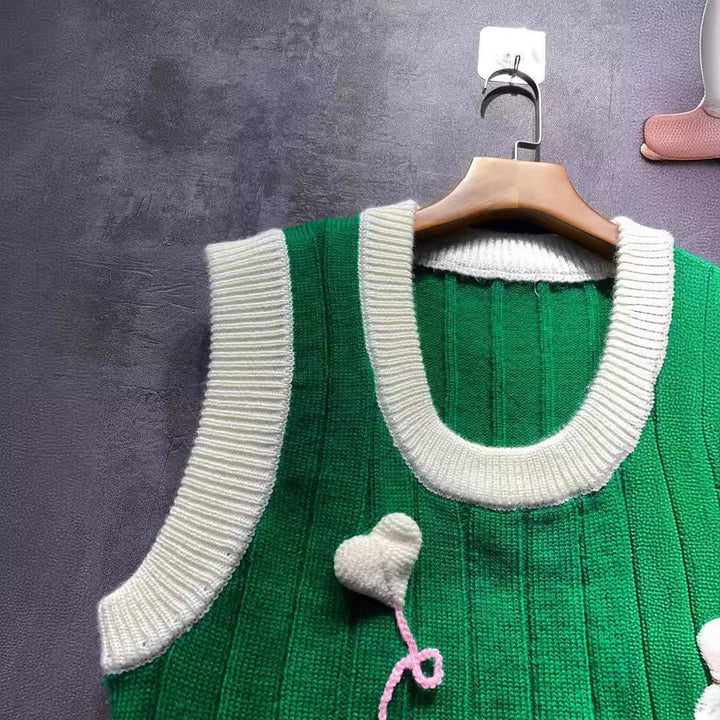 Dame strikvest med hjerteapplikationer og trendy ribstrik Stilla
