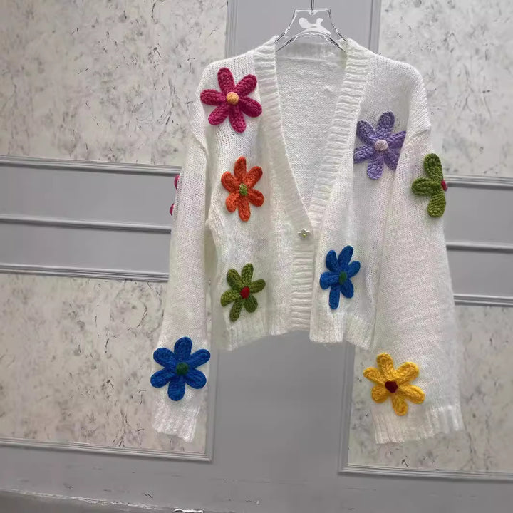 Dame strikjakke med farverigt blomsterdesign Stilla