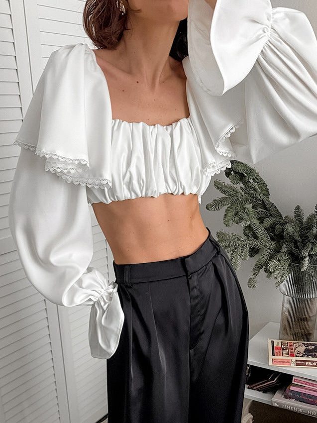 Dame volangstop med asymmetrisk design og elegante detaljer Stilla