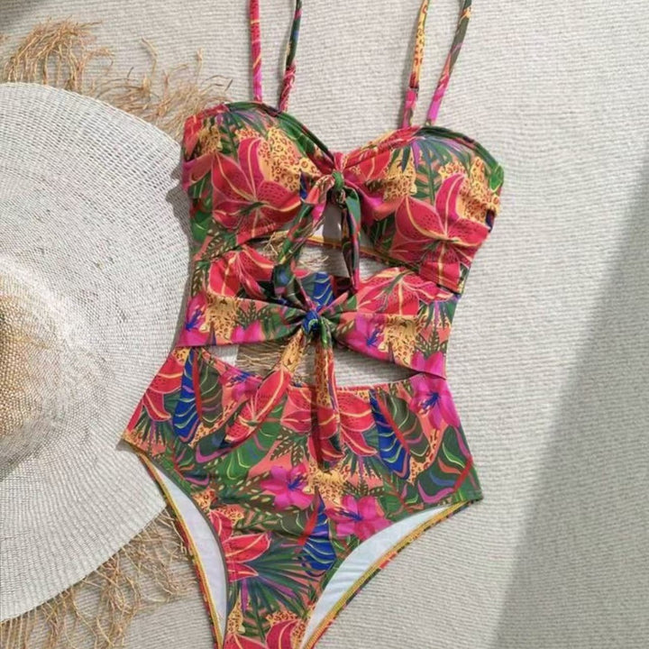 Dame one-piece badedragt med dekorativ knude detalje og legende blomstermønster Skovae