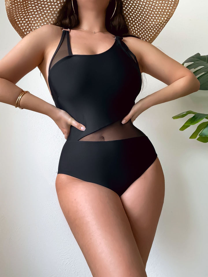 Dame en-delt badedragt med gennemsigtige indsatser og asymmetrisk design Skovae
