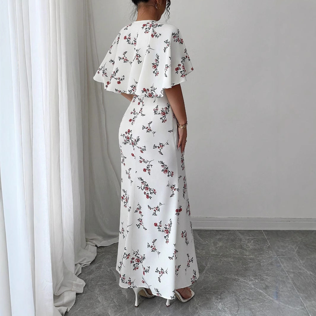 Dame maxikjole med elegante vinger og blomsterdesign Stilla