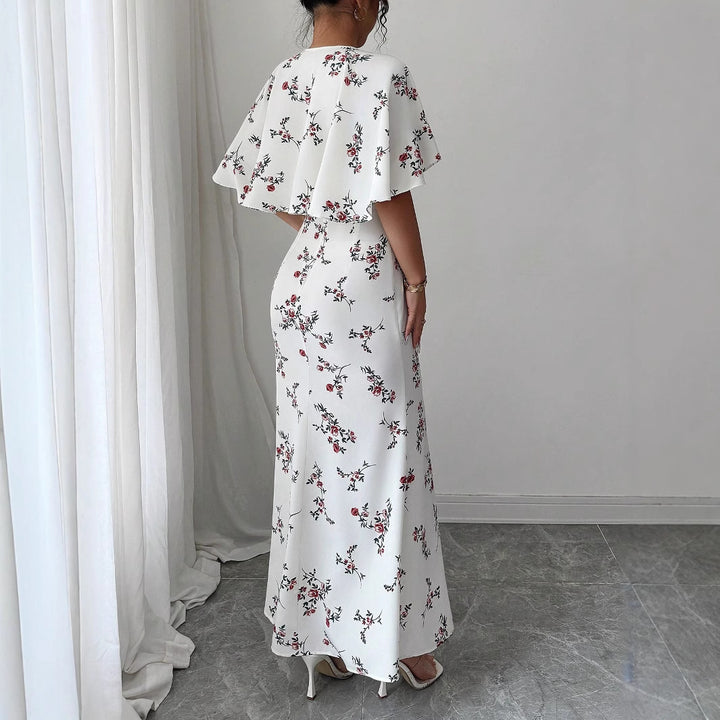 Dame maxikjole med elegante vinger og blomsterdesign Stilla