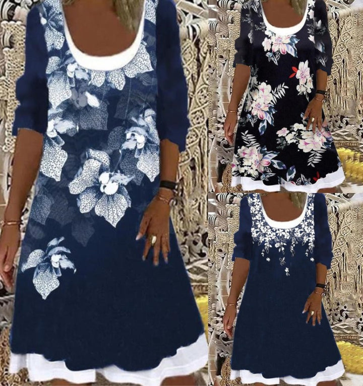 Dame fritidskjole med blomsterdekoration og dyb udskæring Stilla
