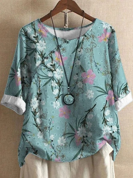 Damer bomuldsbluse med blomstertryk og elegant knaplukning Stilla