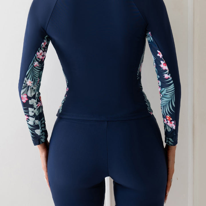Dame surfdragt med lange ærmer og blomsteragtige accenter Skovae