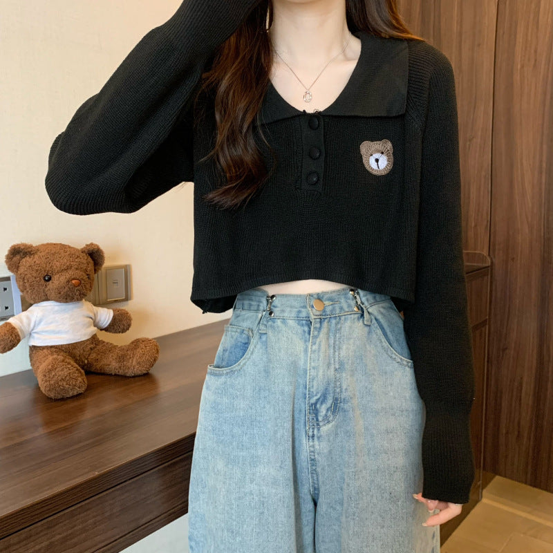 Kvinder Cropped Pullover med en knaplukning og unicorn emblem