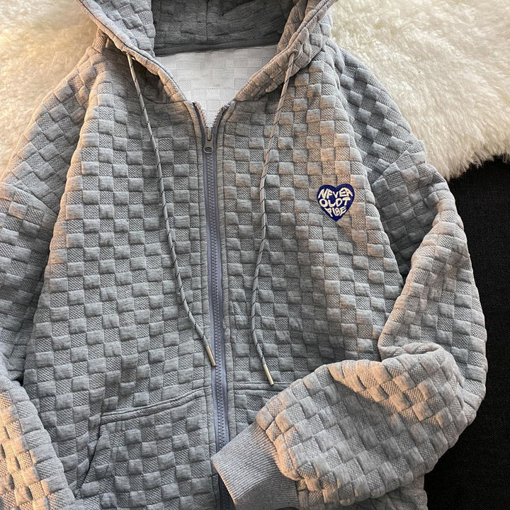 Dame hoodie jakke lavet af struktureret materiale med praktiske lommer og fashionable design