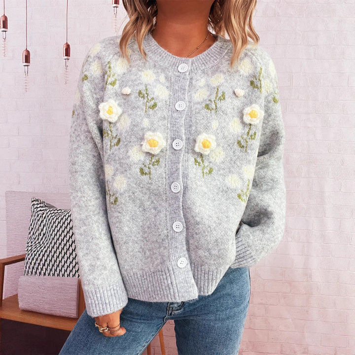Kvinders cardigan med blomsterapplikationer og knaplukning Stilla